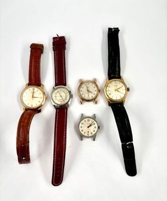 four different types of wrist watches on a white surface