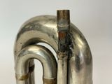 a close up of a metal object with a pipe sticking out of it