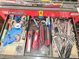 many tools in a tool box on a workbench