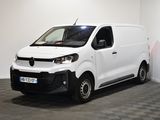 la photo d'une camionnette blanche garée dans une pièce