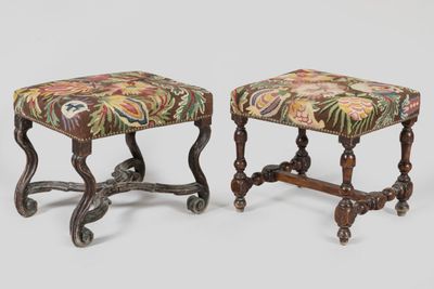 a pair of small stools with a floral upholstered seat