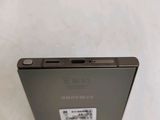 a close up of the back of a black samsung phone