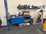 a picture of a garage with a lot of tools on the shelves