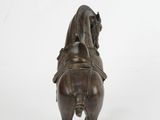 bronze statue of a man riding a horse on a white background