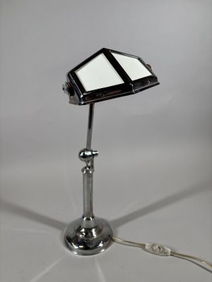 an image of a desk lamp with a cell phone on it