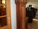 a grandfather clock in the corner of the room