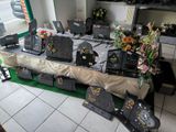 a table that has a bunch of black and gold items on it