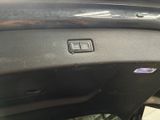 a close up of a car ' s dashboard with a button