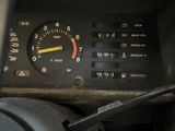 a close up of a car dashboard with a key in it