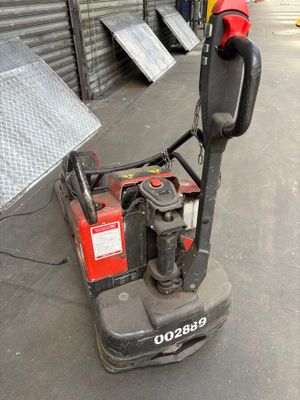 an image of a small machine that is sitting on the ground
