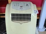 a small air conditioner sitting on the floor in a restaurant