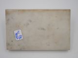 a close up of a piece of paper with a sticker on it