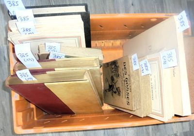 many books in a box with price tags on them