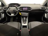 the interior of a car with a steering wheel, dashboard and dashboard controls