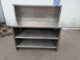 a stainless steel shelf with two shelves on top of it