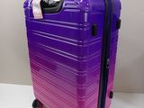 a purple suitcase that is sitting on a table