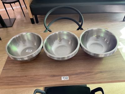 three bowls and a kettle on the table