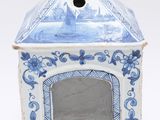 a small blue and white box with a picture inside of it