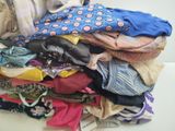a pile of clothes that is sitting on a table