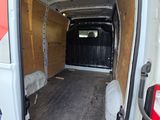 a white van with a wooden floor in the back of it