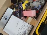 a box full of various items that are sitting on the floor