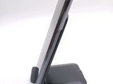 a close up of a cell phone on a stand