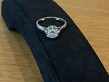a ring that is sitting on top of a black tie