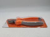 a pair of scissors in a plastic bag on a table
