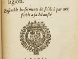 an old book with a picture of a coat of arms on it