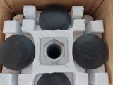 a cardboard box that has a bunch of black and white objects inside of it