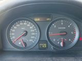 a close up of a car dashboard with a speedometer and gauges