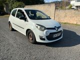 a picture of a small white car parked in a parking lot