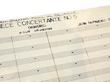 a piece of paper with music notes on it