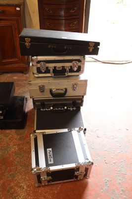 four suitcases stacked on top of each other on the floor