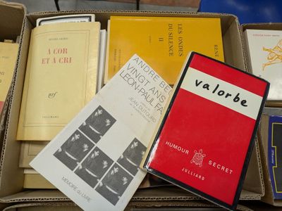 boxes of books are stacked on top of each other on a table