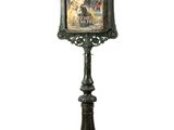 a picture of a clock on a stand with a picture on it