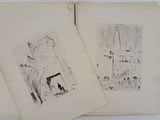two open books with drawings on them sitting on top of a table