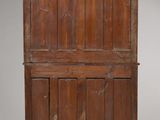 an old wooden chest with a wooden top and two doors