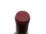 a bottle of wine that is sitting on a table