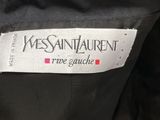 a close up of a label on the back of a black jacket
