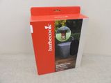 the box is open to show the contents of a portable coffee maker