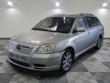 a silver car that is parked on a checkered floor