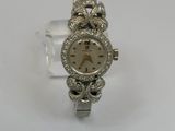 an image of a lady ' s wrist watch with diamonds on it