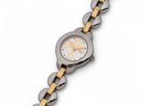 a close up of a watch on a white surface with a yellow band