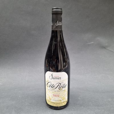 a bottle of wine sitting on top of a table