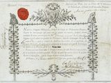an old document with a red wax seal on top of it