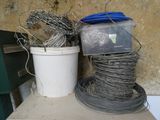 a bucket of wire and a bucket of wire sitting on a table