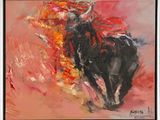 a painting of a bull is shown in a black frame