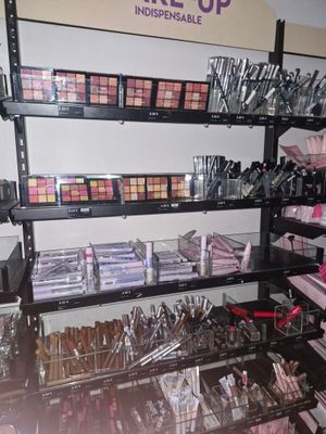 a lot of makeup products on display in a store