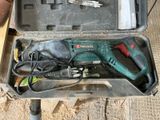 a tool in a case that is sitting on the ground